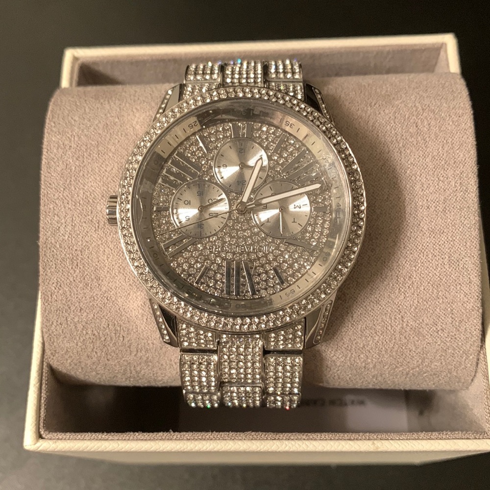 Barely warn MK Watch. Scratch’s can be buffed out. Paid full price